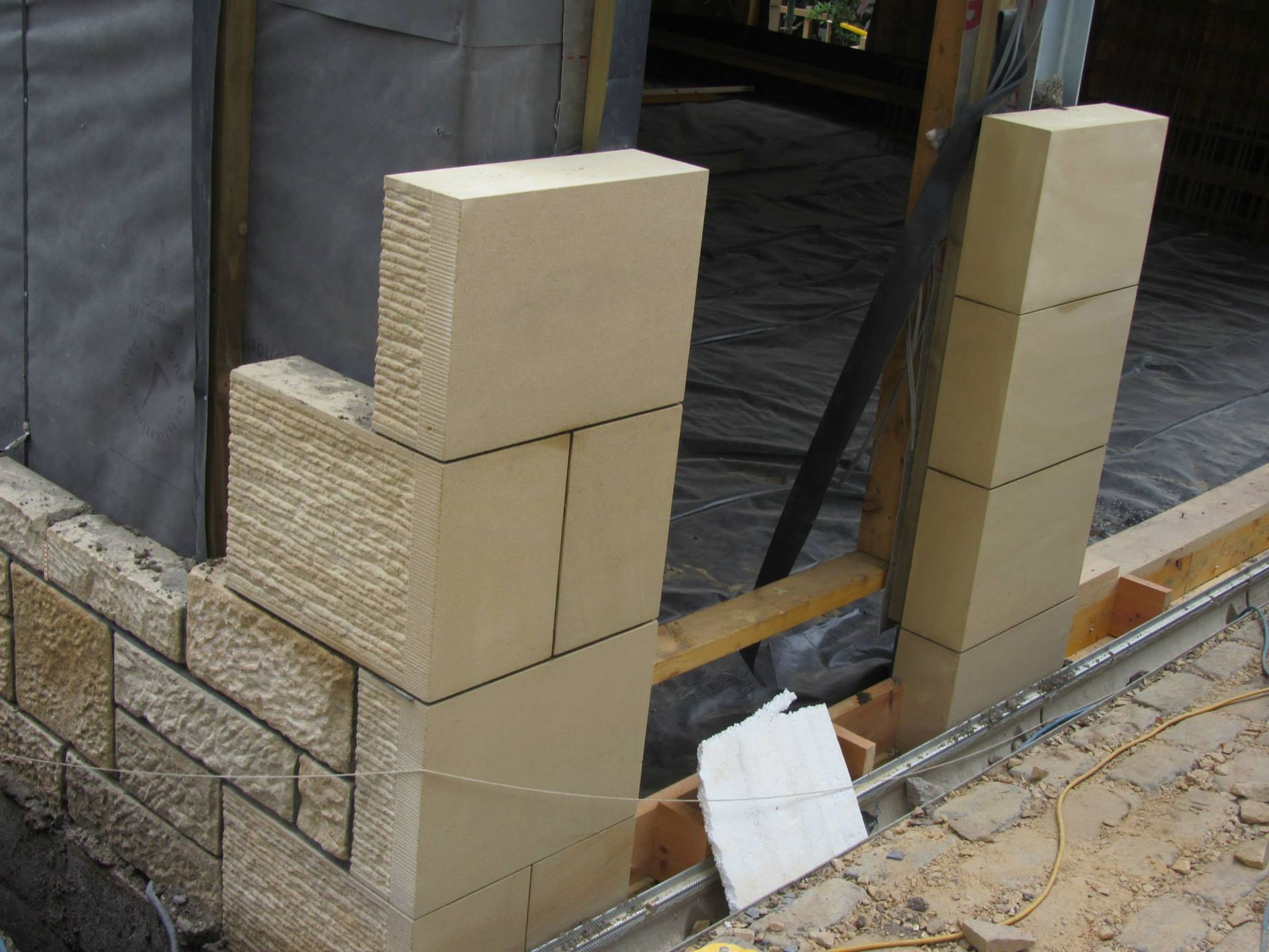 Natural sandstone wall construction for Edinburgh stone masonry projects in progress.
