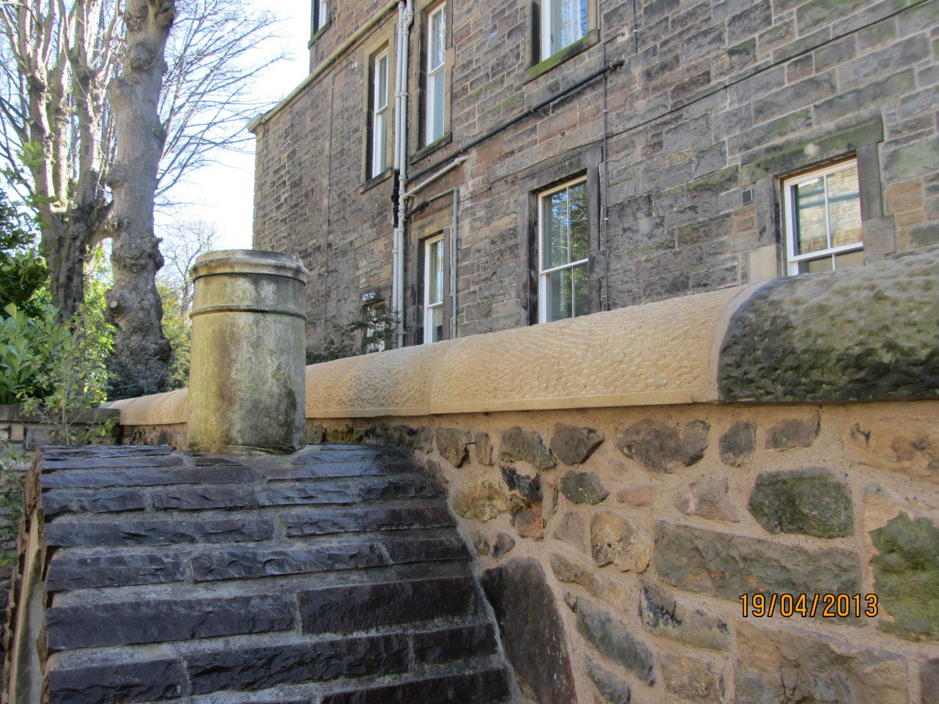 Decorative sandstone wall and stone steps at historic Edinburgh property, crafted by IMC Stonemasons.