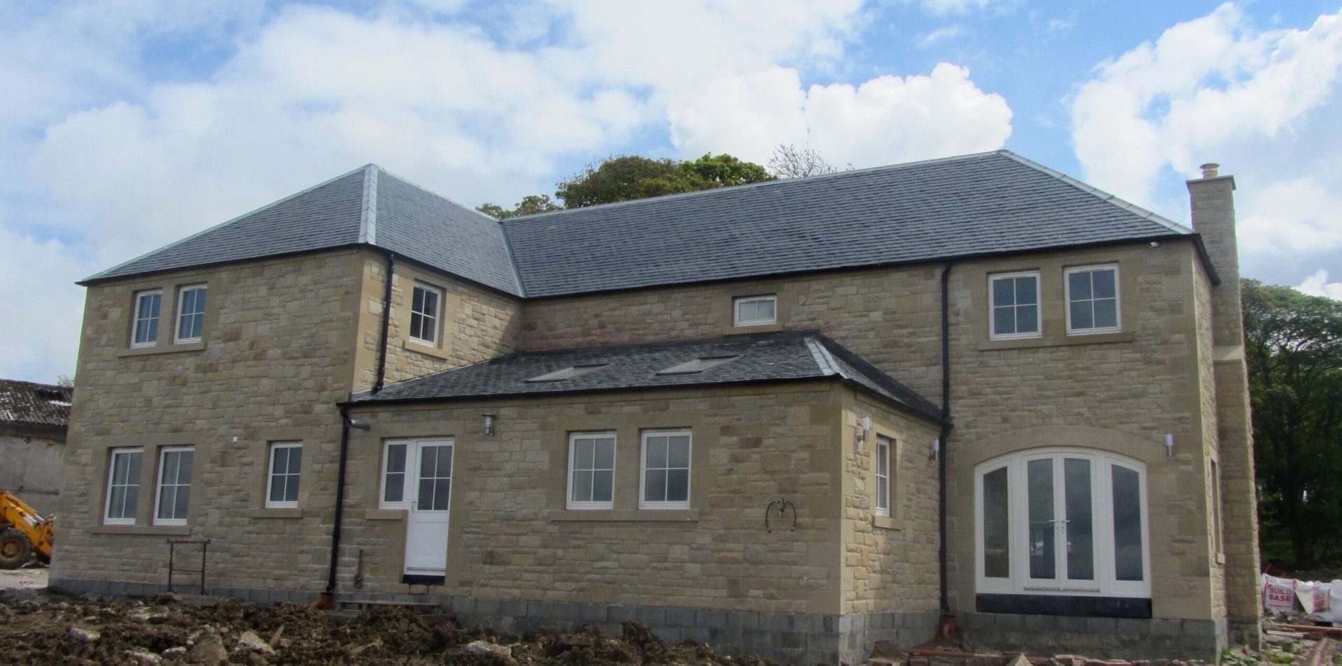 Handcrafted stone masonry house exterior with traditional sandstone finish, Edinburgh stonemasons expertise.