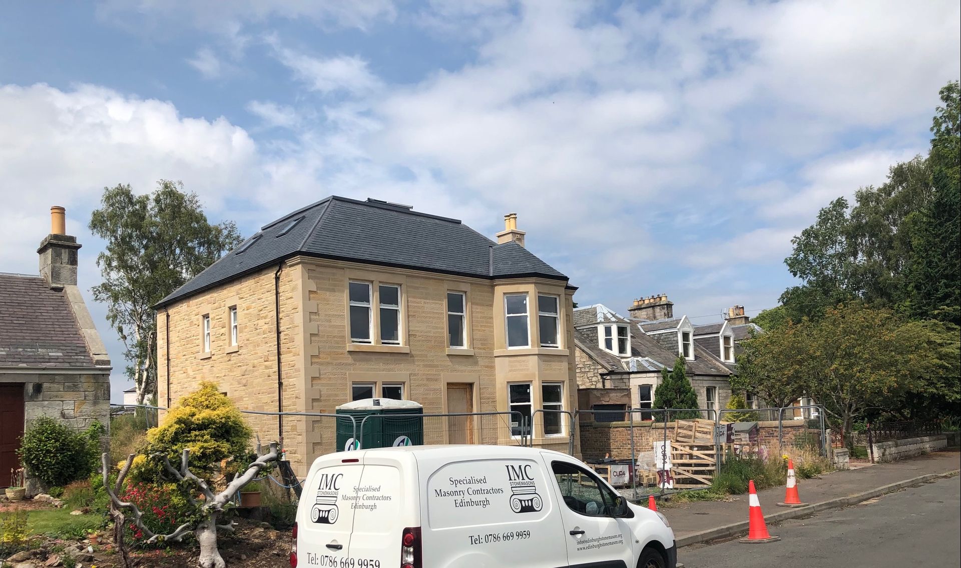 Elegant stone-clad house under renovation by IMC Stonemasons Limited in Edinburgh, showcasing expert masonry craftsmanship.